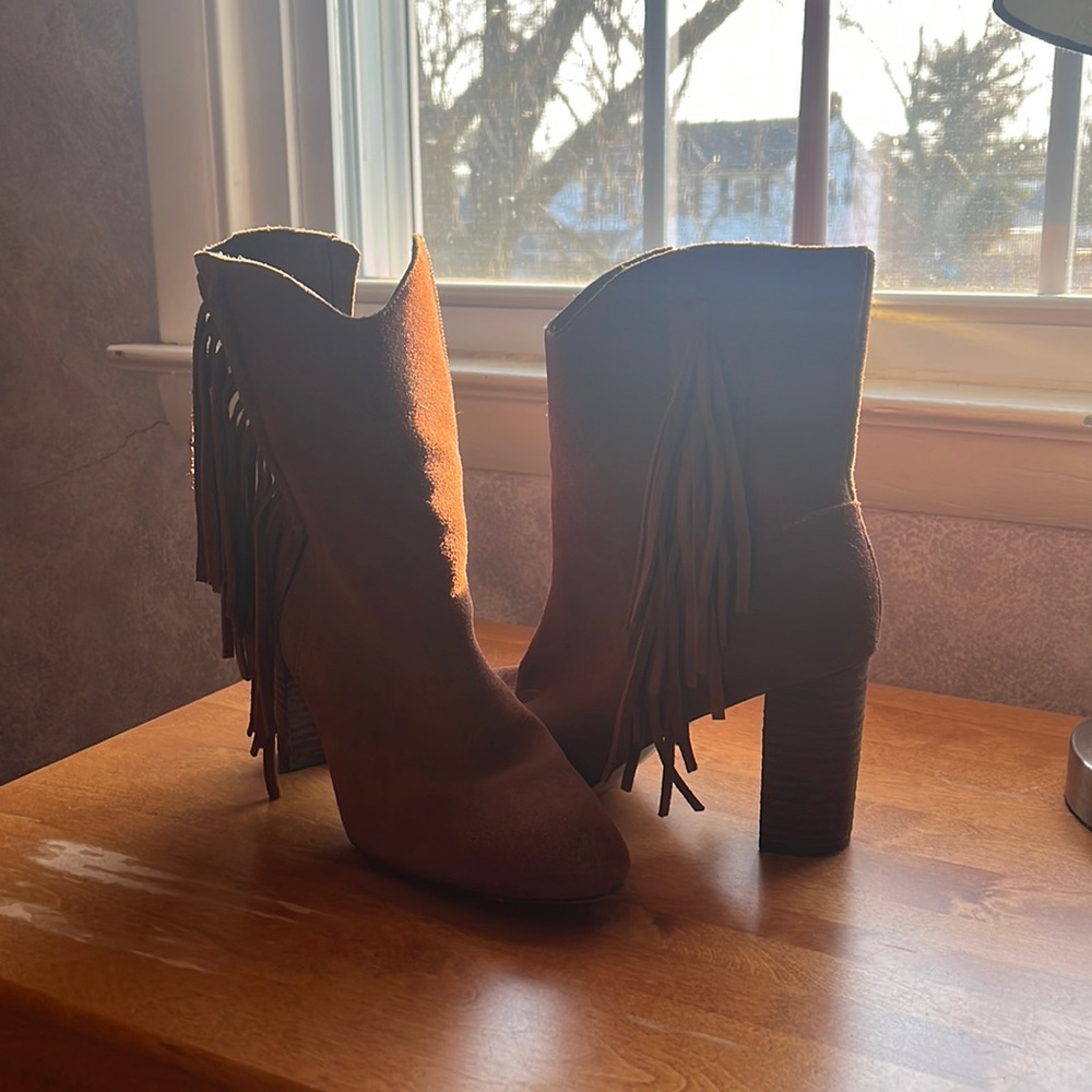Brown boots with fringe.